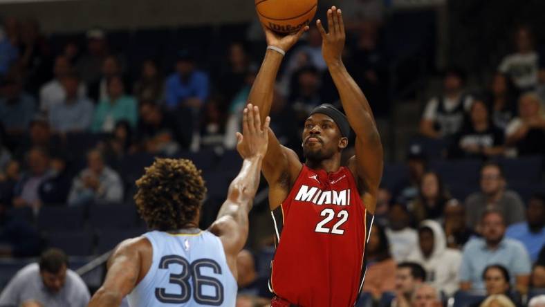 Nov 8, 2023; Memphis, Tennessee, USA; Miami Heat forward Jimmy Butler (22) shoots for three during the first half against the Memphis Grizzlies at FedExForum. Mandatory Credit: Petre Thomas-USA TODAY Sports