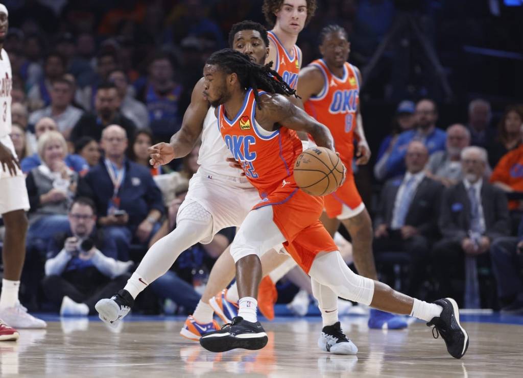 Nov 8, 2023; Oklahoma City, Oklahoma, USA; Oklahoma City Thunder guard Cason Wallace (22) drives to the basket around Cleveland Cavaliers guard Donovan Mitchell (45) during the second quarter at Paycom Center. Mandatory Credit: Alonzo Adams-USA TODAY Sports