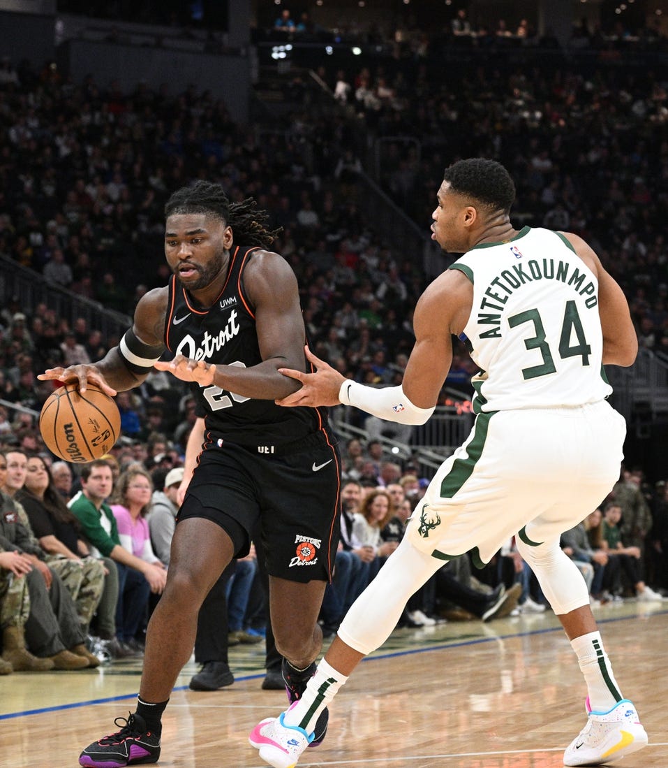 Nov 8, 2023; Milwaukee, Wisconsin, USA; Detroit Pistons guard Marcus Sasser (25) drives to the basket against Milwaukee Bucks forward Giannis Antetokounmpo (34) in the first half at Fiserv Forum. Mandatory Credit: Michael McLoone-USA TODAY Sports