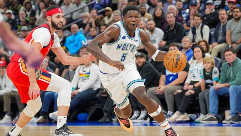 Nov 8, 2023; Minneapolis, Minnesota, USA; Minnesota Timberwolves guard Anthony Edwards (5) dribbles against the New Orleans Pelicans in the second quarter at Target Center. Mandatory Credit: Brad Rempel-USA TODAY Sports