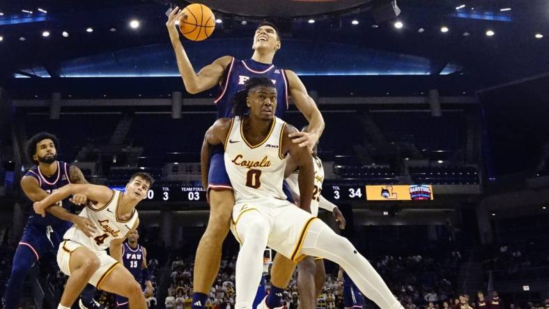 Nov 8, 2023; Chicago, Illinois, USA; Florida Atlantic Owls center Vladislav Goldin (50) is defended by Loyola Ramblers guard Desmond Watson (0)during the second half at Wintrust Arena. Mandatory Credit: David Banks-USA TODAY Sports