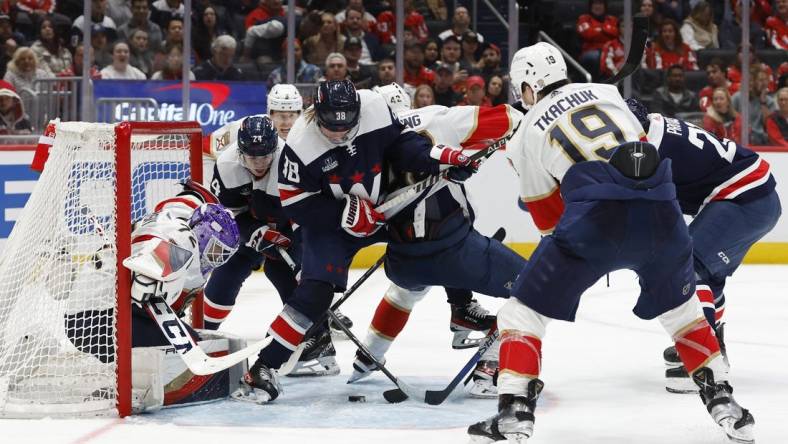 Nov 8, 2023; Washington, District of Columbia, USA; Washington Capitals center Connor McMichael (24) attempts to shoot the puck on Florida Panthers goaltender Sergei Bobrovsky (72) in the third period at Capital One Arena. Mandatory Credit: Geoff Burke-USA TODAY Sports