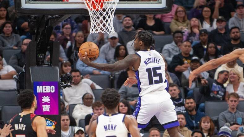 Nov 8, 2023; Sacramento, California, USA; Sacramento Kings guard Davion Mitchell (15) puts up a shot during the first quarter against the Portland Trail Blazers at Golden 1 Center. Mandatory Credit: Ed Szczepanski-USA TODAY Sports