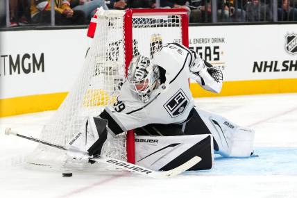 Nov 8, 2023; Las Vegas, Nevada, USA; Los Angeles Kings goaltender Cam Talbot (39) covers up a Vegas Golden Knights dump in during the second period at T-Mobile Arena. Mandatory Credit: Stephen R. Sylvanie-USA TODAY Sports