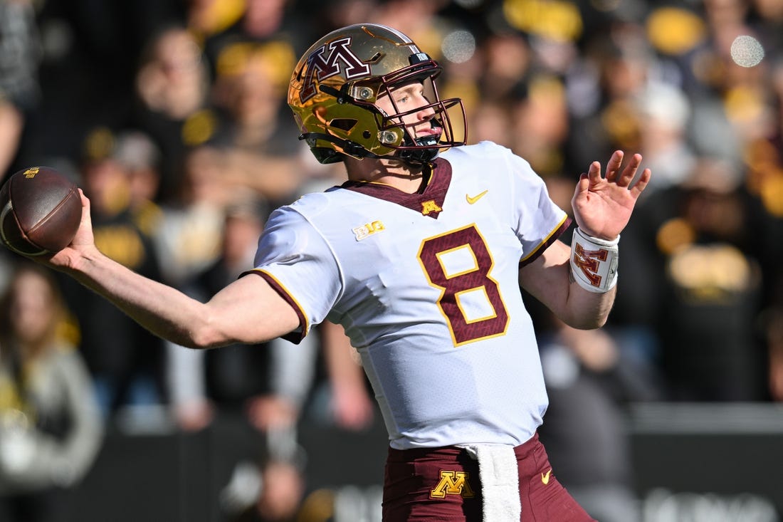 Oct 21, 2023; Iowa City, Iowa, USA; Minnesota Golden Gophers quarterback Athan Kaliakmanis (8) throws a pass against the Iowa Hawkeyes during the first quarter at Kinnick Stadium. Mandatory Credit: Jeffrey Becker-USA TODAY Sports