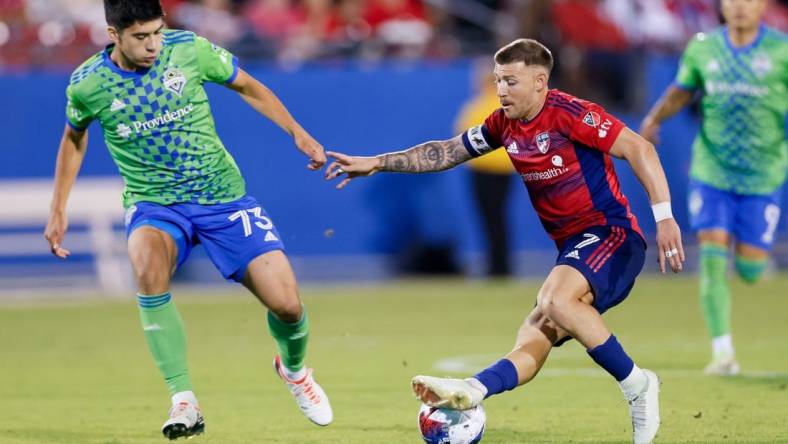 Nov 4, 2023; Frisco, Texas, USA; FC Dallas forward Paul Arriola (7) and Seattle Sounders midfielder Obed Vargas (73) during the second half of game two in a round one match of the 2023 MLS Cup Playoffs at Toyota Stadium. Mandatory Credit: Andrew Dieb-USA TODAY Sports