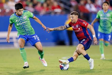 Nov 4, 2023; Frisco, Texas, USA; FC Dallas forward Paul Arriola (7) and Seattle Sounders midfielder Obed Vargas (73) during the second half of game two in a round one match of the 2023 MLS Cup Playoffs at Toyota Stadium. Mandatory Credit: Andrew Dieb-USA TODAY Sports