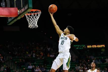 Nov 9, 2023; Waco, Texas, USA;  Baylor Bears guard RayJ Dennis (10) scores a layup against the John Brown Golden Eagles during the second half at Ferrell Center. Mandatory Credit: Chris Jones-USA TODAY Sports