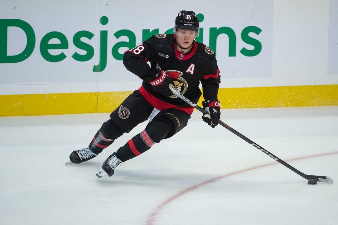 Nov 9, 2023; Ottawa, Ontario, CAN; Ottawa Senators center Tim Stutzle (18) skates with the puck in the third period against the Vancouver Canucks at the Canadian Tire Centre. Mandatory Credit: Marc DesRosiers-USA TODAY Sports