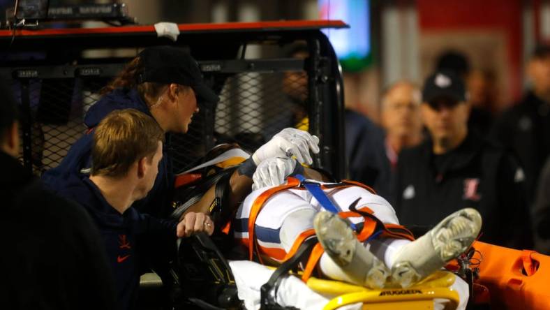 Virginia   s Perris Jones is carted off the field against Louisville in L & N Stadium. 
Nov. 9, 2023