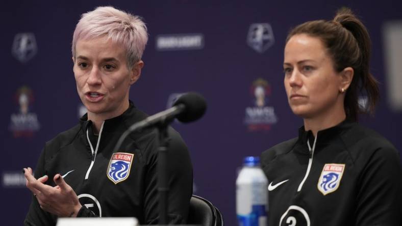 Nov 10, 2023; San Diego, California, USA; OL Reign forward Megan Rapinoe (15) speaks alongside defender Lauren Barnes (3) during a press conference at Snapdragon Stadium. Mandatory Credit: Kyle Terada-USA TODAY Sports