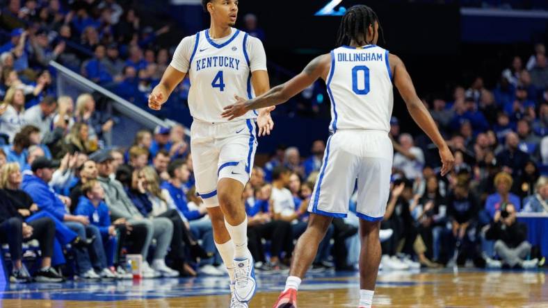 Nov 10, 2023; Lexington, Kentucky, USA; Kentucky Wildcats forward Tre Mitchell (4) fives guard Rob Dillingham (0) during the first half against the Texas A&M Commerce Lions at Rupp Arena at Central Bank Center. Mandatory Credit: Jordan Prather-USA TODAY Sports