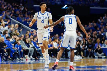 Nov 10, 2023; Lexington, Kentucky, USA; Kentucky Wildcats forward Tre Mitchell (4) fives guard Rob Dillingham (0) during the first half against the Texas A&M Commerce Lions at Rupp Arena at Central Bank Center. Mandatory Credit: Jordan Prather-USA TODAY Sports