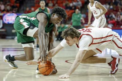 Nov 10, 2023; Norman, Oklahoma, USA;Mississippi Valley State Delta Devils forward Quoiren Waldon (20) and Oklahoma Sooners forward Luke Northweather (45) fight for a loose ball during the first half at Lloyd Noble Center. Mandatory Credit: Alonzo Adams-USA TODAY Sports
