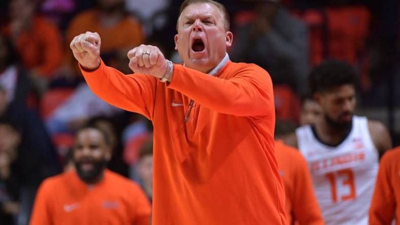 Nov 10, 2023; Champaign, Illinois, USA;  Illinois Fighting Illini head coach Brad Underwood reacts off the bench during the first half against the Oakland Golden Grizzlies at State Farm Center. Mandatory Credit: Ron Johnson-USA TODAY Sports