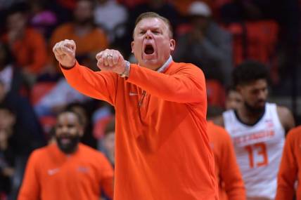 Nov 10, 2023; Champaign, Illinois, USA;  Illinois Fighting Illini head coach Brad Underwood reacts off the bench during the first half against the Oakland Golden Grizzlies at State Farm Center. Mandatory Credit: Ron Johnson-USA TODAY Sports