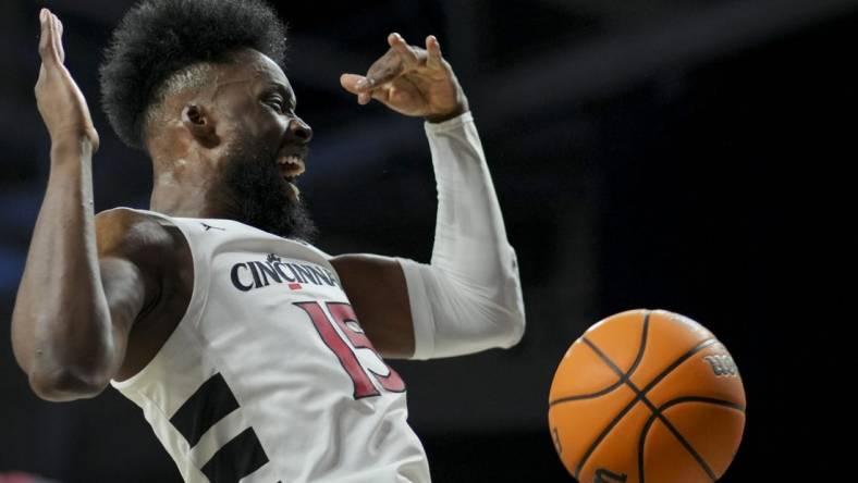 Nov 10, 2023; Cincinnati, Ohio, USA;  Cincinnati Bearcats forward John Newman III (15) reacts after dunking the ball against the Detroit Mercy Titans in the first half at Fifth Third Arena. Mandatory Credit: Aaron Doster-USA TODAY Sports