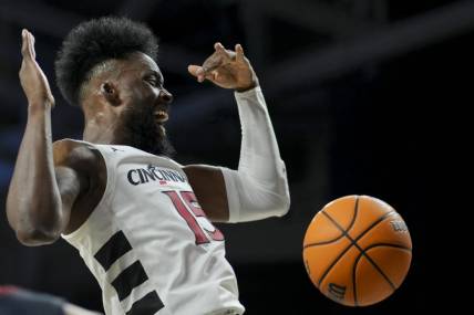 Nov 10, 2023; Cincinnati, Ohio, USA;  Cincinnati Bearcats forward John Newman III (15) reacts after dunking the ball against the Detroit Mercy Titans in the first half at Fifth Third Arena. Mandatory Credit: Aaron Doster-USA TODAY Sports