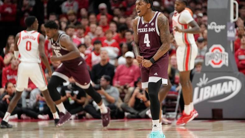 Nov 10, 2023; Columbus, Ohio, USA; Texas A&M Aggies guard Wade Taylor IV (4) celebrates a basket during the second half of the NCAA basketball game against the Ohio State Buckeyes at Value City Arena. Ohio State lost 73-66.