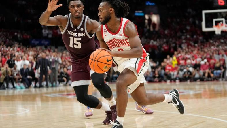 Nov 10, 2023; Columbus, Ohio, USA; Ohio State Buckeyes guard Bruce Thornton (2) drives past Texas A&M Aggies forward Henry Coleman III (15) during the second half of the NCAA basketball game at Value City Arena. Ohio State lost 73-66.