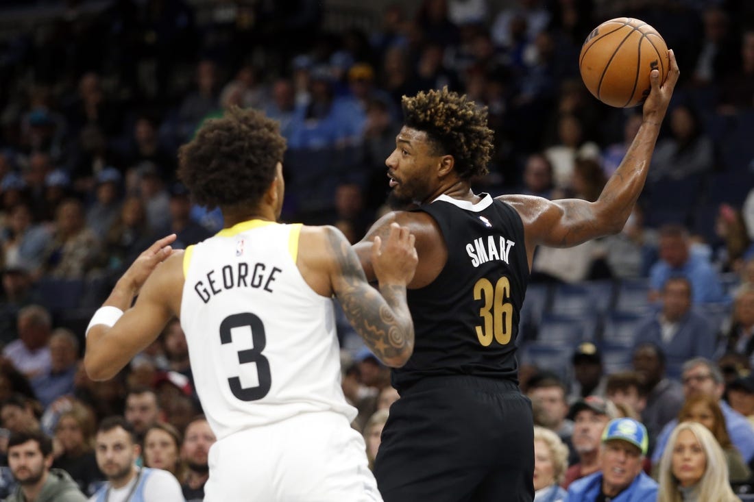 Nov 10, 2023; Memphis, Tennessee, USA; Memphis Grizzlies guard Marcus Smart (36) handles the ball as Utah Jazz guard Keyonte George (3) defends during the first half at FedExForum. Mandatory Credit: Petre Thomas-USA TODAY Sports