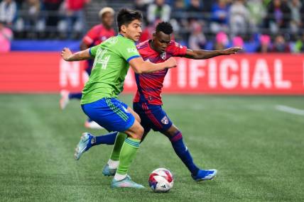 Nov 10, 2023; Seattle, Washington, USA; Seattle Sounders midfielder Josh Atencio (84) looks for a pass as FC Dallas forward J  der Obrian (8) defends during the first half at Lumen Field. Mandatory Credit: Steven Bisig-USA TODAY Sports