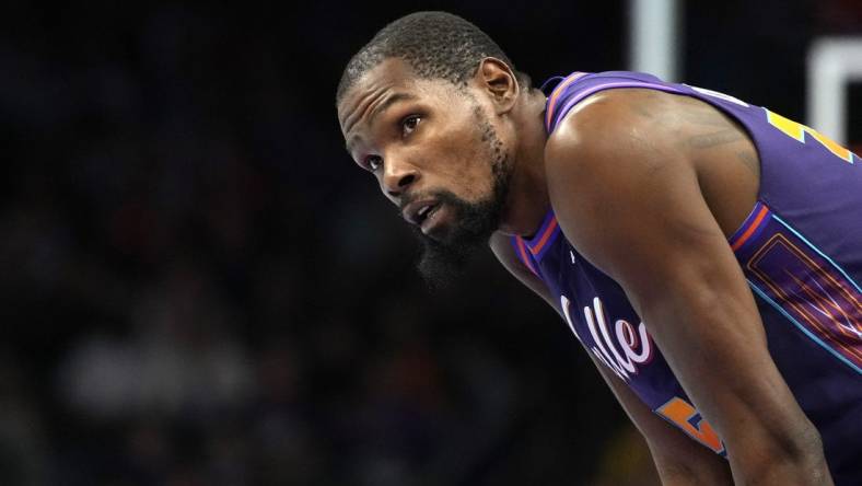 Nov 10, 2023; Phoenix, Arizona, USA; Phoenix Suns forward Kevin Durant (35) watches a replay against the Los Angeles Lakers in the first half at Footprint Center. Mandatory Credit: Rick Scuteri-USA TODAY Sports