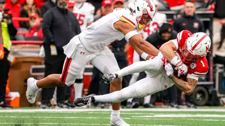 Nov 11, 2023; Lincoln, Nebraska, USA; Nebraska Cornhuskers wide receiver Billy Kemp IV (1) is brought down by Maryland Terrapins defensive back Beau Brade (2) during the second quarter at Memorial Stadium. Mandatory Credit: Dylan Widger-USA TODAY Sports