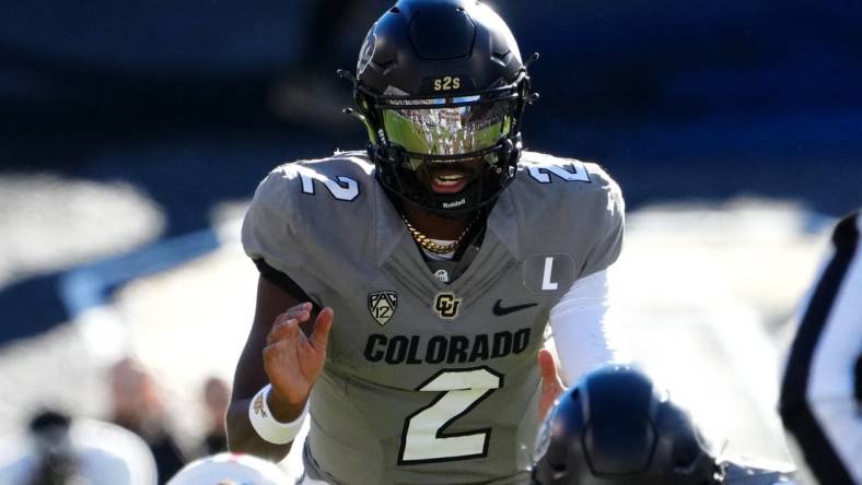 Nov 11, 2023; Boulder, Colorado, USA; Colorado Buffaloes quarterback Shedeur Sanders (2) at the line of scrimmage in the first half against the Arizona Wildcats at Folsom Field. Mandatory Credit: Ron Chenoy-USA TODAY Sports