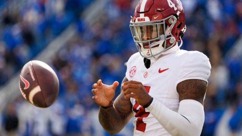 Nov 11, 2023; Lexington, Kentucky, USA; Alabama Crimson Tide quarterback Jalen Milroe (4) warms up during a timeout during the third quarter against the Kentucky Wildcats at Kroger Field. Mandatory Credit: Jordan Prather-USA TODAY Sports