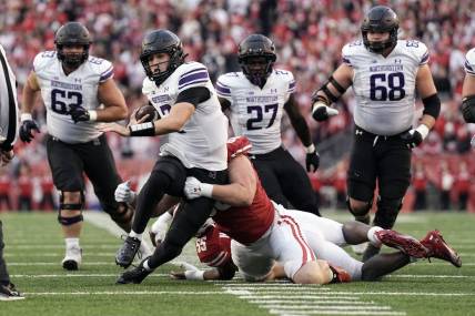 Nov 11, 2023; Madison, Wisconsin, USA;  Northwestern Wildcats quarterback Ben Bryant (2) rushes with the football during the second quarter against the Wisconsin Badgers at Camp Randall Stadium. Mandatory Credit: Jeff Hanisch-USA TODAY Sports