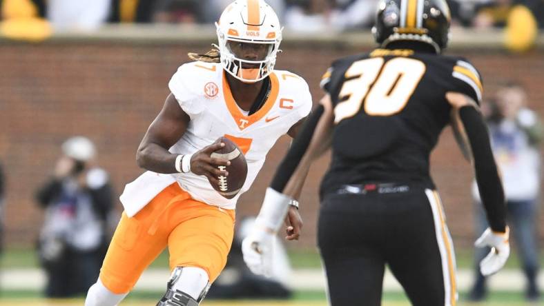 Tennessee quarterback Joe Milton III (7) runs with the ball during NCAA college football game against Missouri on Saturday, November 11, 2023 in Columbia, MO.