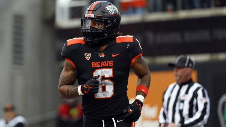 Nov 11, 2023; Corvallis, Oregon, USA; Oregon State Beavers running back Damien Martinez (6) celebrates after scoring a touchdown during the first half against the Stanford Cardinal at Reser Stadium. Mandatory Credit: Soobum Im-USA TODAY Sports