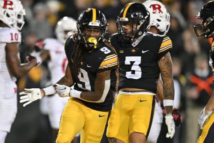 Nov 11, 2023; Iowa City, Iowa, USA; Iowa Hawkeyes running back Jaziun Patterson (9) and wide receiver Kaleb Brown (3) react after a touchdown by Patterson against the Rutgers Scarlet Knights during the fourth quarter at Kinnick Stadium. Mandatory Credit: Jeffrey Becker-USA TODAY Sports