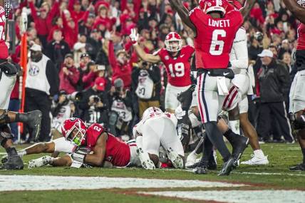 Nov 11, 2023; Athens, Georgia, USA; Georgia Bulldogs running back Kendall Milton (2) scores a touchdown against the Mississippi Rebels during the first half at Sanford Stadium. Mandatory Credit: Dale Zanine-USA TODAY Sports
