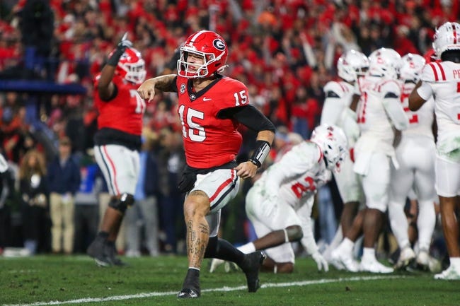 Nov 11, 2023; Athens, Georgia, USA; Georgia Bulldogs quarterback Carson Beck (15) celebrates after a touchdown against the Mississippi Rebels in the second quarter at Sanford Stadium. Mandatory Credit: Brett Davis-USA TODAY Sports