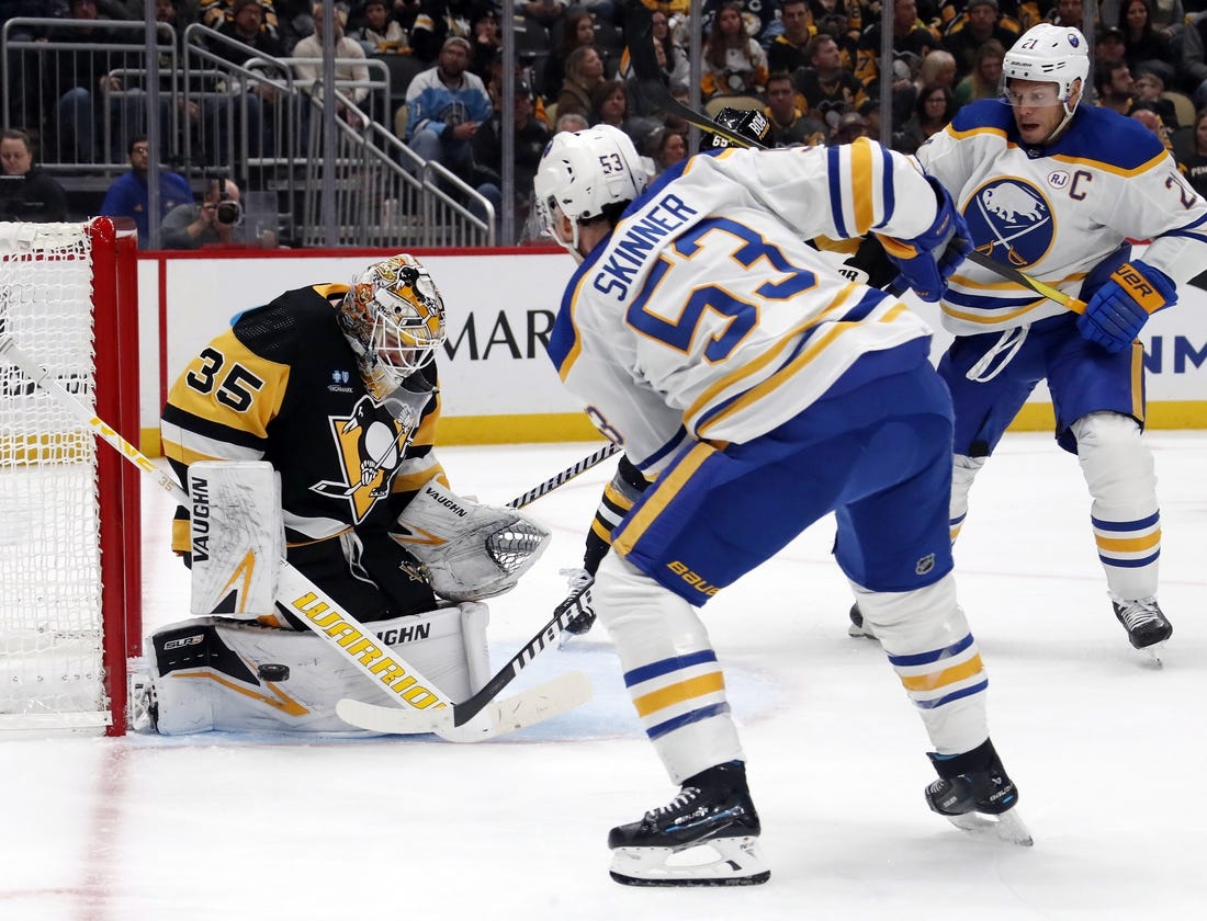 Nov 11, 2023; Pittsburgh, Pennsylvania, USA;  Pittsburgh Penguins goaltender Tristan Jarry (35) makes a save against Buffalo Sabres left wing Jeff Skinner (53) during the second period at PPG Paints Arena. Mandatory Credit: Charles LeClaire-USA TODAY Sports