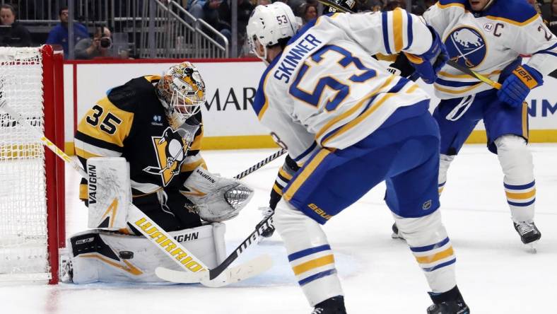 Nov 11, 2023; Pittsburgh, Pennsylvania, USA;  Pittsburgh Penguins goaltender Tristan Jarry (35) makes a save against Buffalo Sabres left wing Jeff Skinner (53) during the second period at PPG Paints Arena. Mandatory Credit: Charles LeClaire-USA TODAY Sports