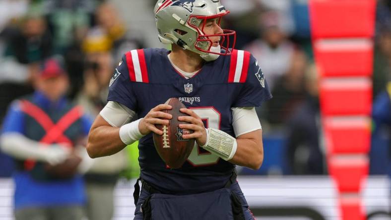 Nov 12, 2023; Frankfurt, Germany;  New England Patriots quarterback Mac Jones (10) drops back to pass against the Indianapolis Colts in the first quarter during an International Series game at Deutsche Bank Park. Mandatory Credit: Nathan Ray Seebeck-USA TODAY Sports