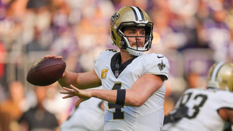 Nov 12, 2023; Minneapolis, Minnesota, USA; New Orleans Saints quarterback Derek Carr (4) passes against the Minnesota Vikings in the first quarter at U.S. Bank Stadium. Mandatory Credit: Brad Rempel-USA TODAY Sports