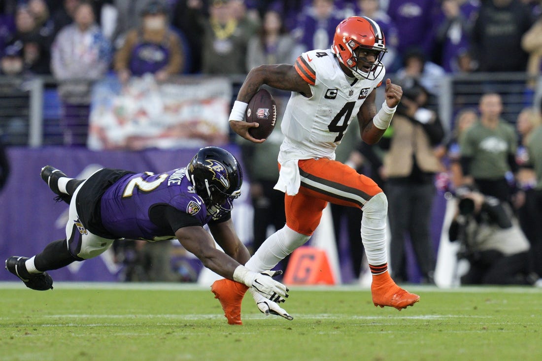 Nov 12, 2023; Baltimore, Maryland, USA; Cleveland Browns quarterback Deshaun Watson (4) runs with the ball as Baltimore Ravens defensive tackle Justin Madubuike (92) defends during the second half at M&T Bank Stadium. Mandatory Credit: Jessica Rapfogel-USA TODAY Sports