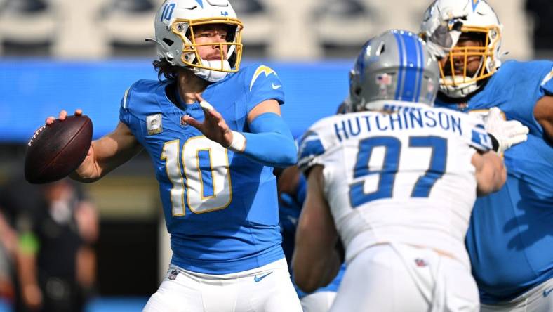 Nov 12, 2023; Inglewood, California, USA; Los Angeles Chargers quarterback Justin Herbert (10) throws a pass against the Detroit Lions during the first half at SoFi Stadium. Mandatory Credit: Orlando Ramirez-USA TODAY Sports