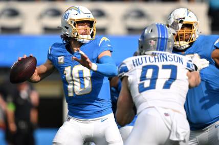Nov 12, 2023; Inglewood, California, USA; Los Angeles Chargers quarterback Justin Herbert (10) throws a pass against the Detroit Lions during the first half at SoFi Stadium. Mandatory Credit: Orlando Ramirez-USA TODAY Sports