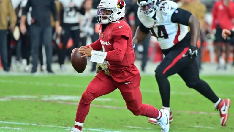 Nov 12, 2023; Glendale, Arizona, USA;  Arizona Cardinals quarterback Kyler Murray (1) runs with the ball as Atlanta Falcons defensive tackle Albert Huggins (94) pursues in the first half at State Farm Stadium. Mandatory Credit: Matt Kartozian-USA TODAY Sports