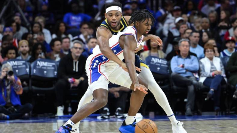 Nov 12, 2023; Philadelphia, Pennsylvania, USA; Indiana Pacers forward Bruce Brown (11) tries to steal the ball away from Philadelphia 76ers guard Tyrese Maxey (0) during the first quarter at Wells Fargo Center. Mandatory Credit:  John Jones-USA TODAY Sports