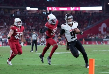 Nov 12, 2023; Glendale, Arizona, USA; Atlanta Falcons quarterback Desmond Ridder (9) runs for a touchdown against the Arizona Cardinals during the second half at State Farm Stadium. Mandatory Credit: Joe Camporeale-USA TODAY Sports