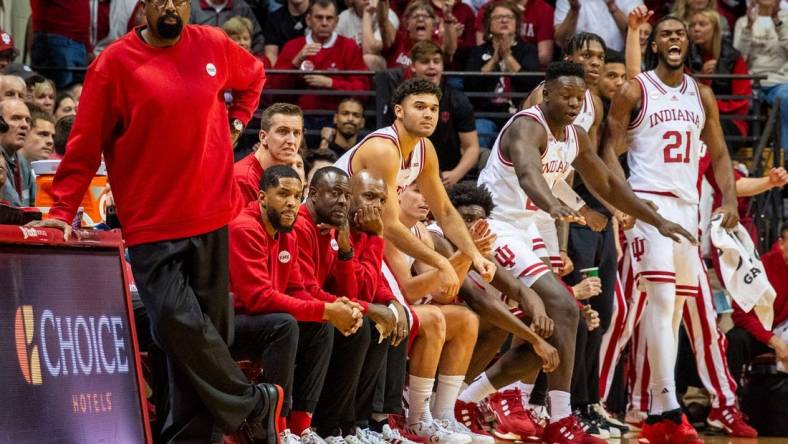 Indiana Head Coach Mike Woodson and the coaching staff wear red sweaters during the first half of the Indiana versus Army men's basketball game at Simon Skjodt Assembly Hall on Sunday, Nov. 12. 2023.