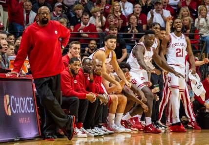 Indiana Head Coach Mike Woodson and the coaching staff wear red sweaters during the first half of the Indiana versus Army men's basketball game at Simon Skjodt Assembly Hall on Sunday, Nov. 12. 2023.