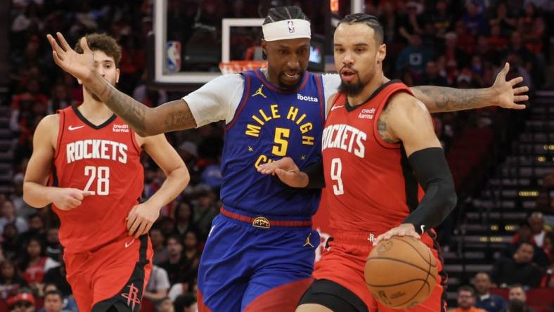 Nov 12, 2023; Houston, Texas, USA; Houston Rockets forward Dillon Brooks (9) dribbles against Denver Nuggets guard Kentavious Caldwell-Pope (5) in the second quarter at Toyota Center. Mandatory Credit: Thomas Shea-USA TODAY Sports