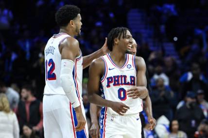 Nov 12, 2023; Philadelphia, Pennsylvania, USA; Philadelphia 76ers guard Tyrese Maxey (0) is greeted by Philadelphia 76ers forward Tobias Harris (12) after a 50 point performance against the Indiana Pacers at Wells Fargo Center. Mandatory Credit:  John Jones-USA TODAY Sports